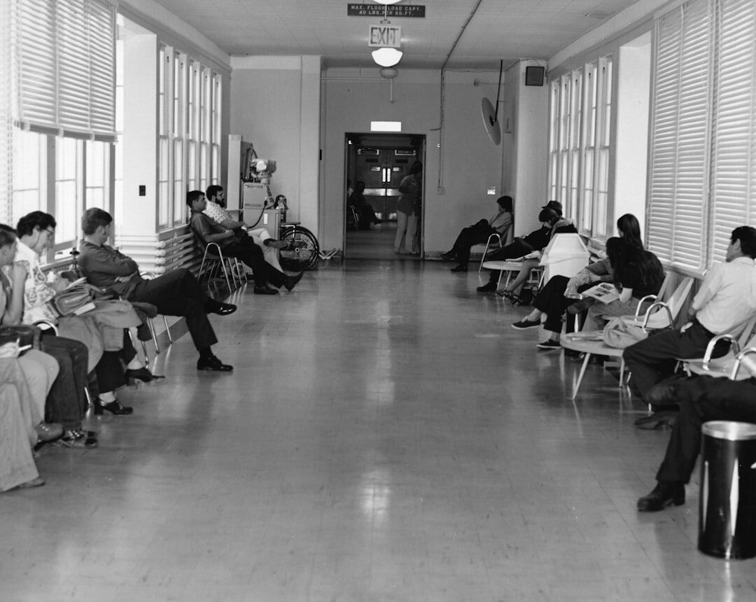 Healthcare professionals discussing in a clinic hallway