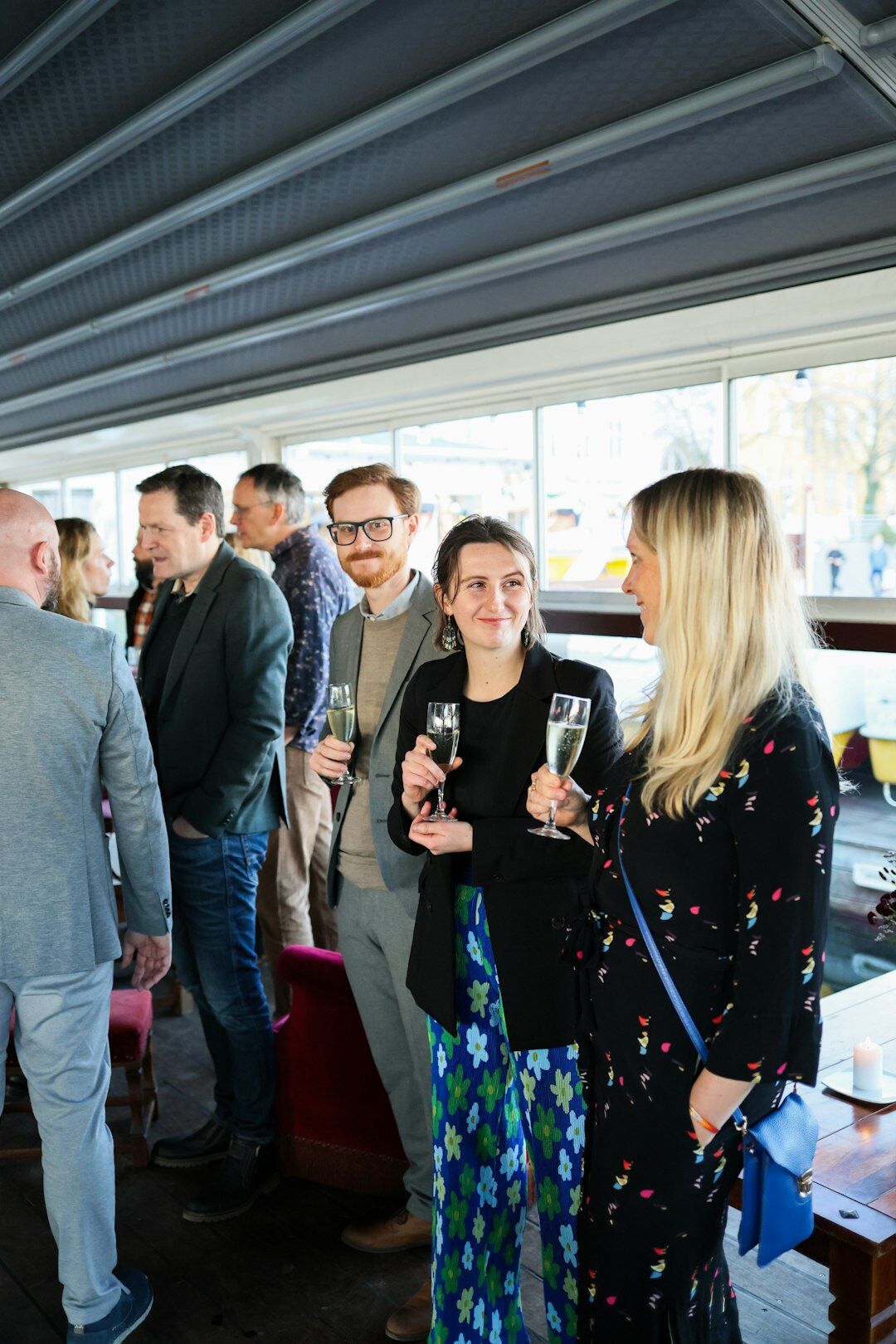 Group of business professionals networking and talking at a corporate event