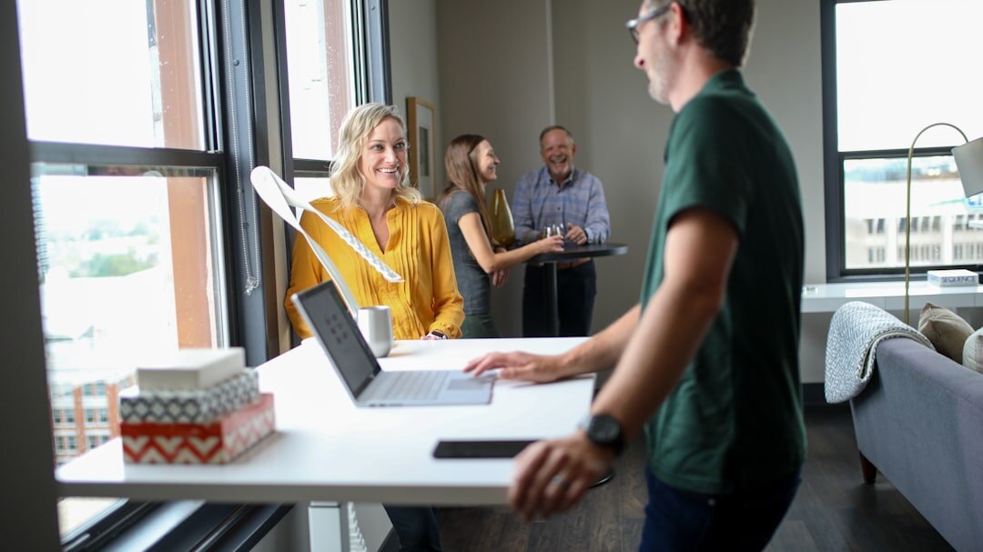 Team of colleagues discussing around a table in a modern office
