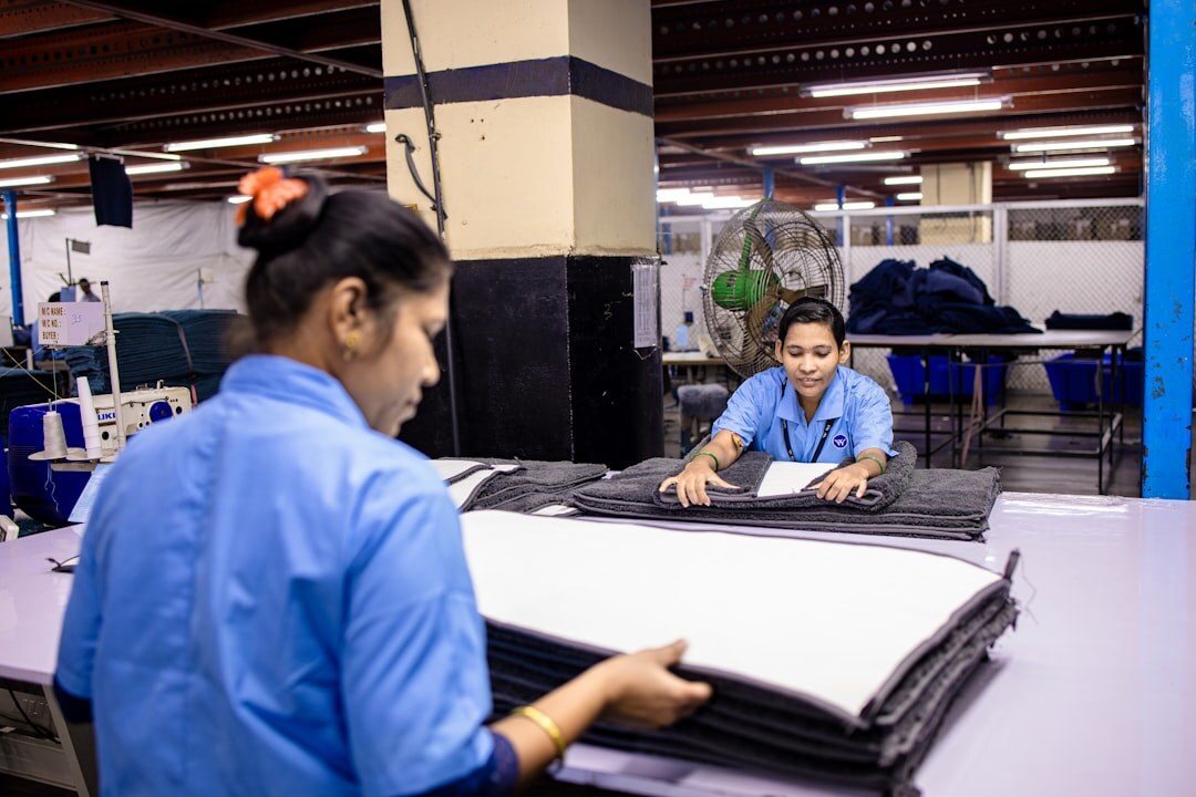 Industrial engineers reviewing plans in a factory